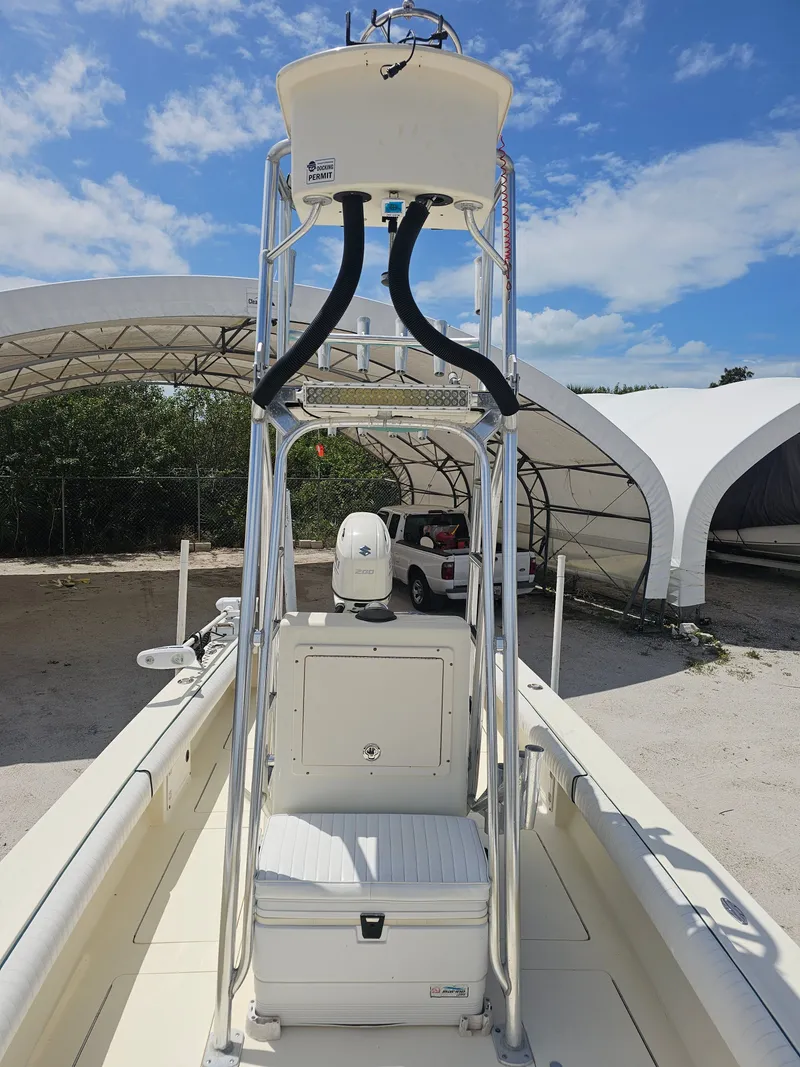 Slide: The Image of 2000 Dorado 23 boat with tower under blue sky. - 6