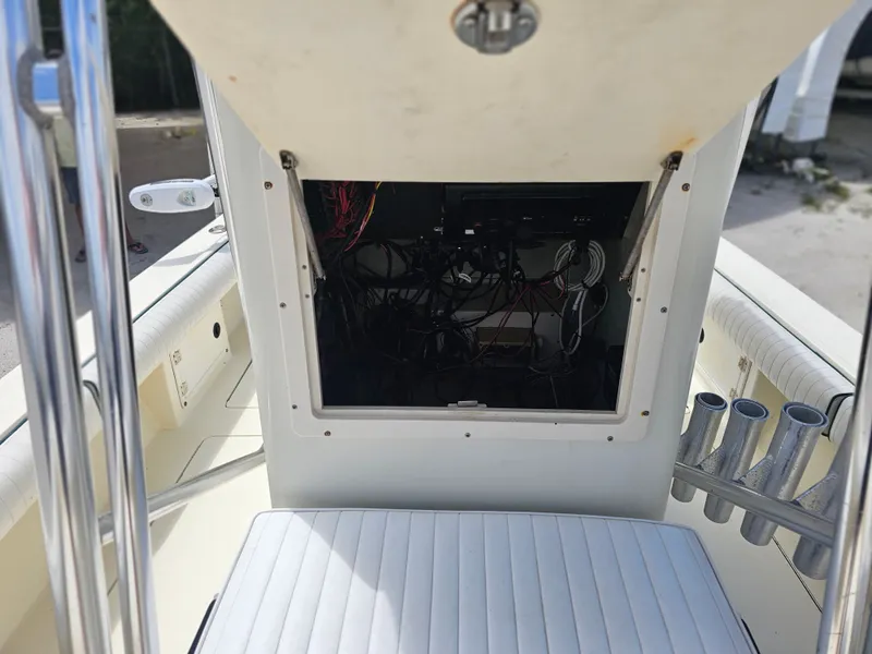 Slide: The Image of Interior view of a 2000 Dorado 23 boat with open electronics compartment. - 8