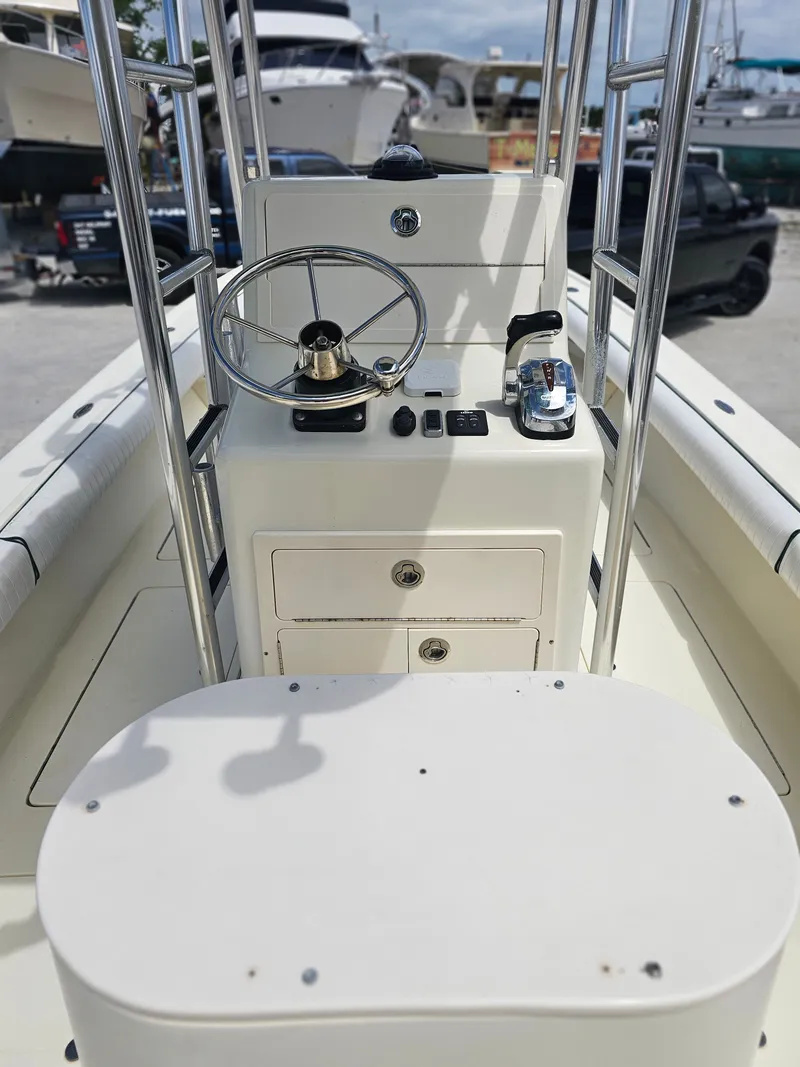 Slide: The Image of Steering console of a 2000 Dorado 23 boat with wheel and controls. - 9