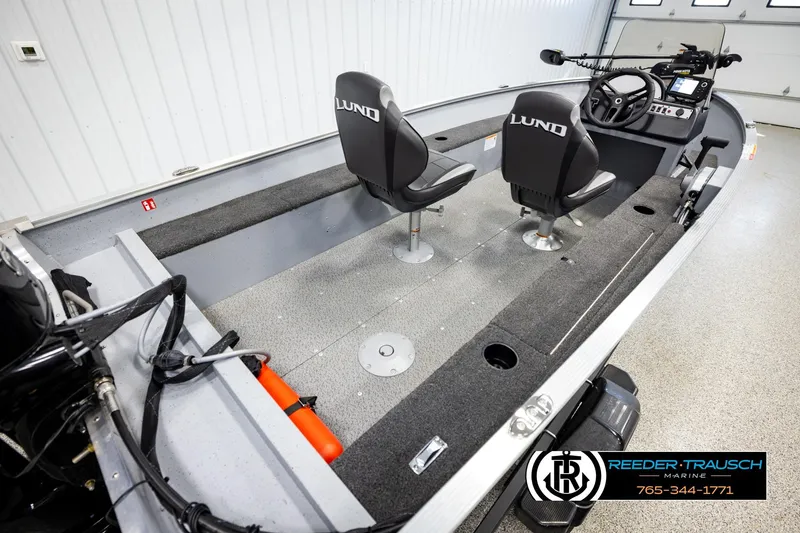 Slide: The Image of 2025 Lund 1600 Fury SS fishing boat interior with dual seats and control console. - 10