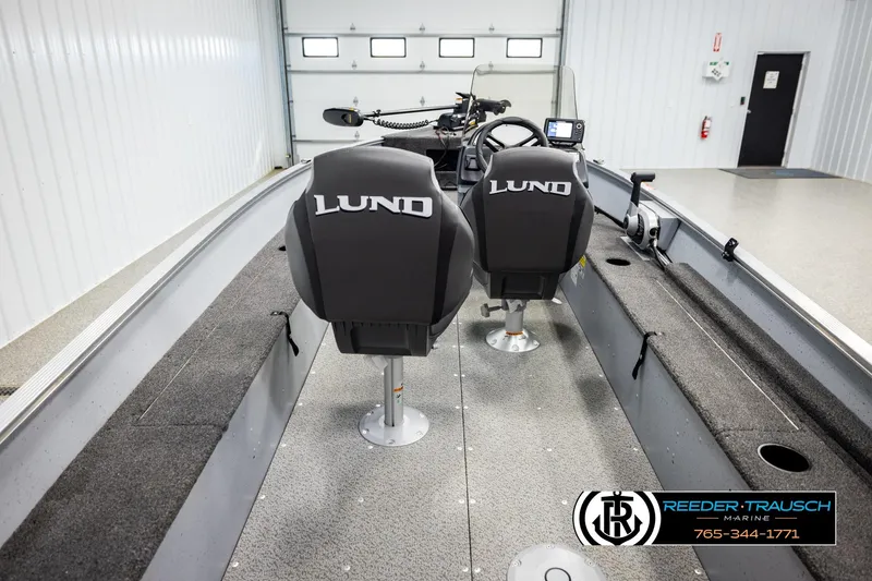 Slide: The Image of 2025 Lund 1600 Fury SS boat interior with dual seats and steering console. - 11