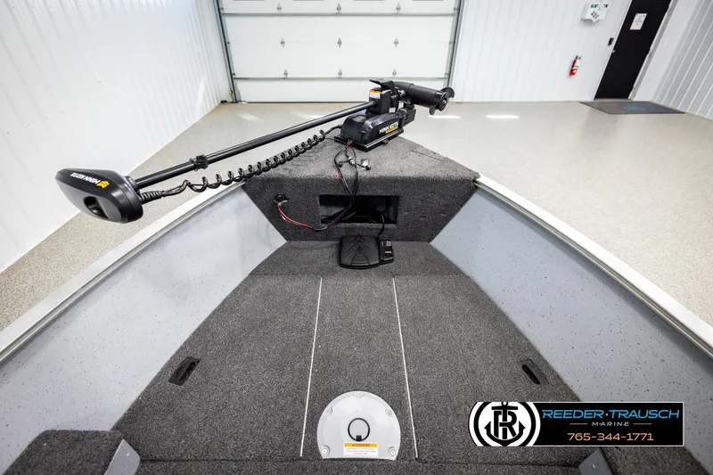Slide: The Image of 2025 Lund 1600 Fury SS boat interior with Minn Kota trolling motor, showcased by Reeder-Trausch Marine. - 13