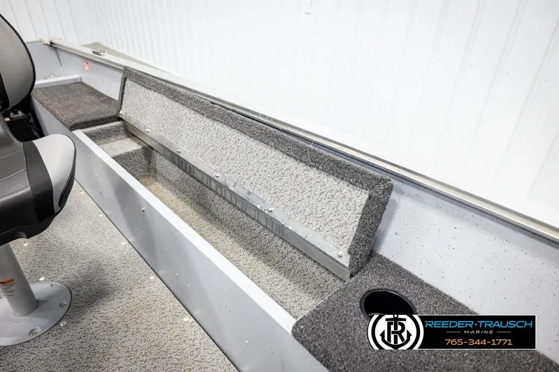 Slide: The Image of 2025 Lund 1600 Fury SS boat interior with seating and storage compartments. - 20