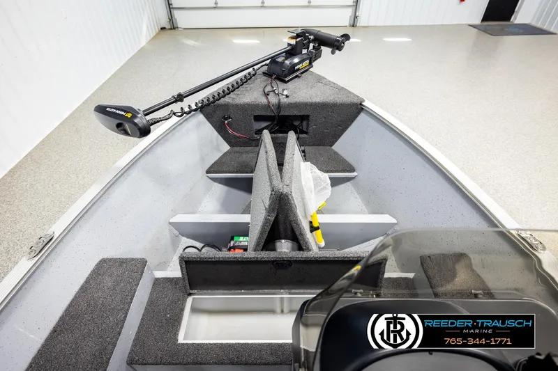 Slide: The Image of 2025 Lund 1600 Fury SS boat interior with trolling motor and storage compartments. - 22