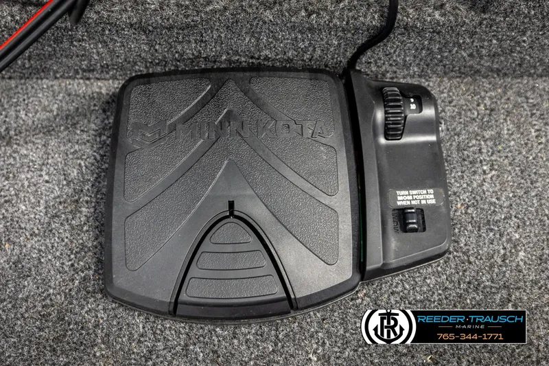 Slide: The Image of Minn Kota foot pedal on Lund 1600 Fury SS 2025 boat, Reeder-Trausch Marine logo visible. - 24