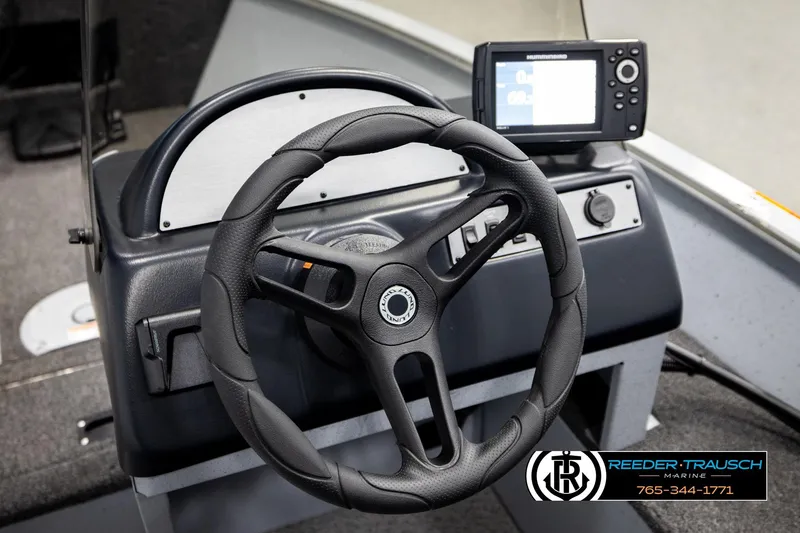 Slide: The Image of Steering wheel and dashboard of 2025 Lund 1600 Fury SS boat with navigation system. - 29
