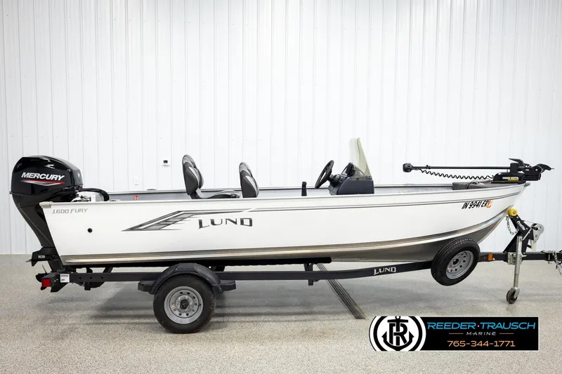 Slide: The Image of 2025 Lund 1600 Fury SS fishing boat with Mercury engine on trailer. - 3