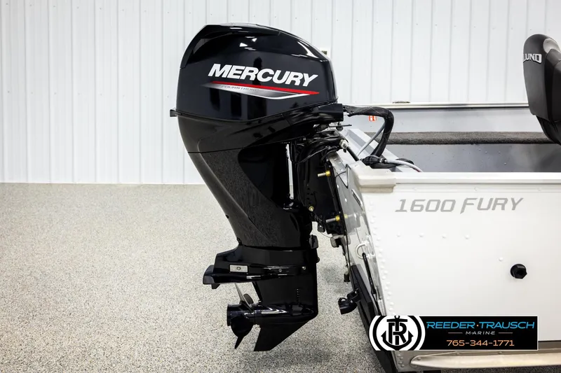 Slide: The Image of 2025 Lund 1600 Fury SS boat with Mercury outboard motor in showroom setting. - 36