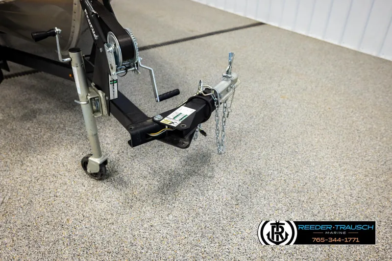 Slide: The Image of Trailer hitch of 2025 Lund 1600 Fury SS boat on showroom floor. - 41