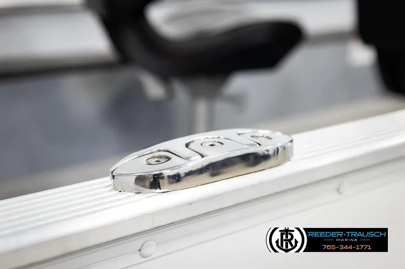 Slide: The Image of 2025 Lund 1600 Fury SS boat detail with chrome hardware, Reeder-Trausch Marine branding. - 46