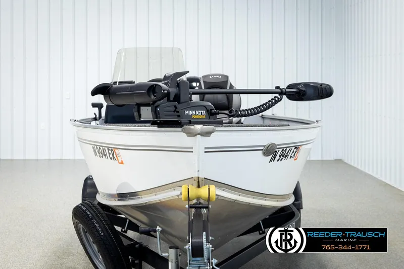 Slide: The Image of 2025 Lund 1600 Fury SS boat with Minn Kota motor in showroom. - 6