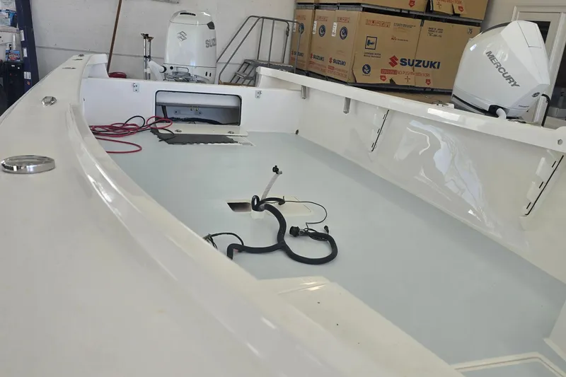 Slide: The Image of 2023 Albury Brothers 23 Forward Seating boat interior with Suzuki and Mercury engines. - 2