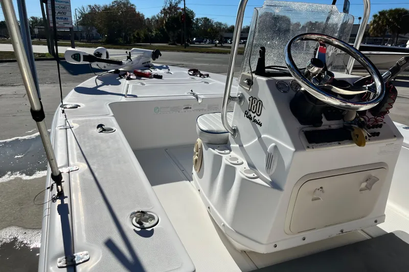 Slide: The Image of 2007 Sea Chaser 180 Flats boat interior with steering console and fishing equipment. - 3