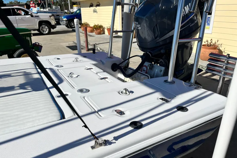 Slide: The Image of 2007 Sea Chaser 180 Flats boat with Yamaha engine, docked outdoors. - 4