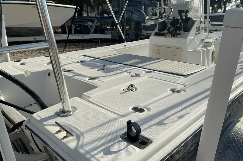 Slide: The Image of 2007 Sea Chaser 180 Flats boat interior with steering console and storage compartments. - 9