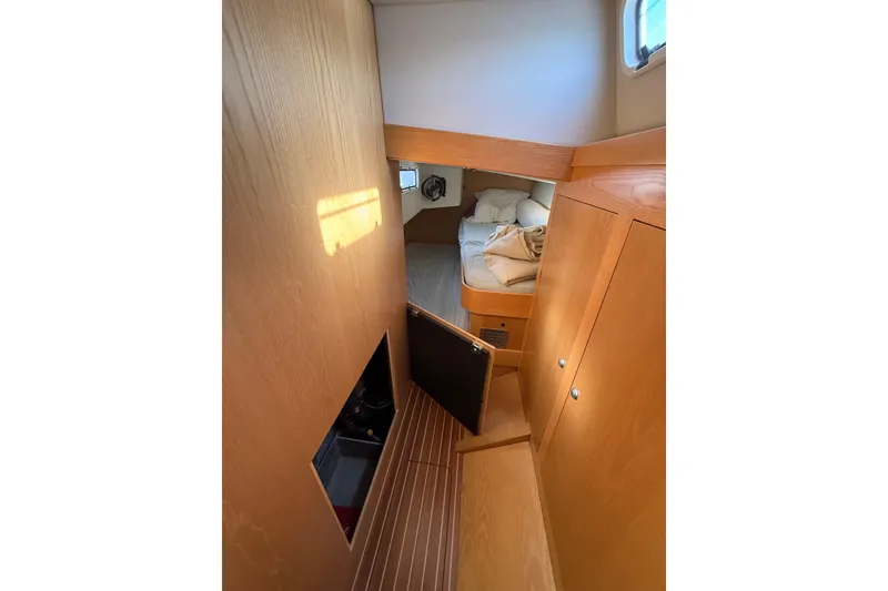 Slide: The Image of Cozy cabin interior of 2017 Boreal 47 sailboat with wooden furnishings and bed. - 10