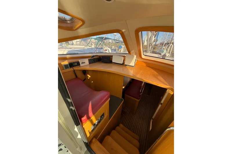 Slide: The Image of Interior of 2017 Boreal 47 sailboat with navigation equipment and wooden finish. - 16