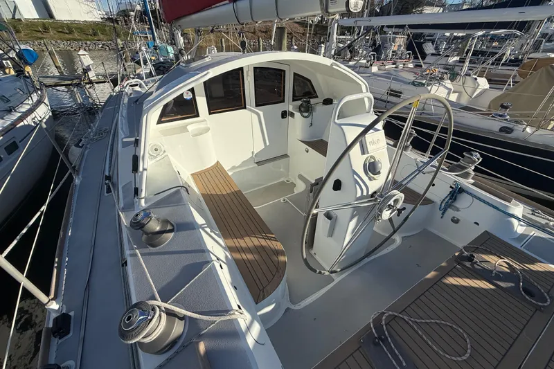 Slide: The Image of Cockpit of 2017 Boreal 47 sailboat with steering wheel and teak flooring. - 17