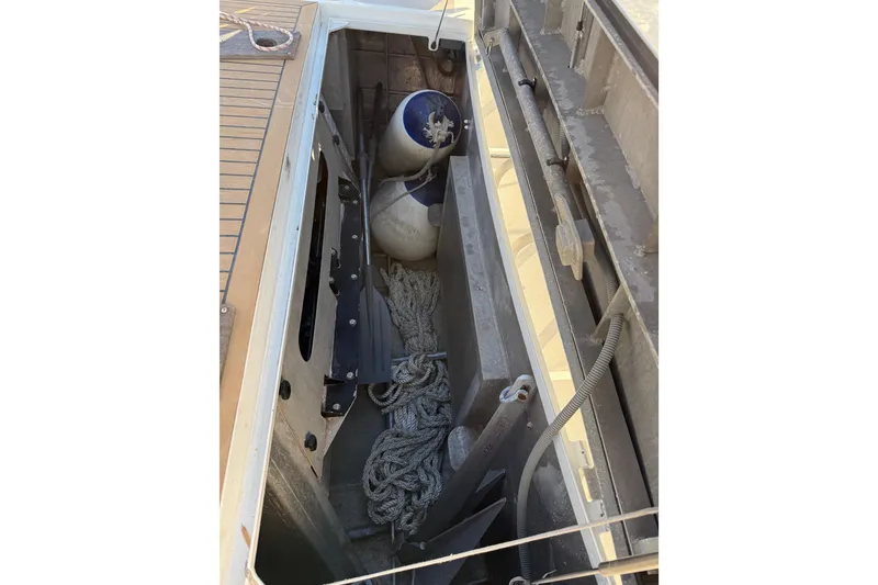 Slide: The Image of Storage compartment on 2017 Boreal 47 sailboat with ropes and fenders. - 19