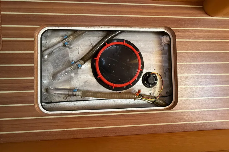 Slide: The Image of Access hatch of a 2017 Boreal 47 yacht, showing internal piping and wiring. - 22