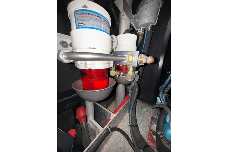 Slide: The Image of Diesel fuel filter system in a 2017 Boreal 47 engine compartment. - 29