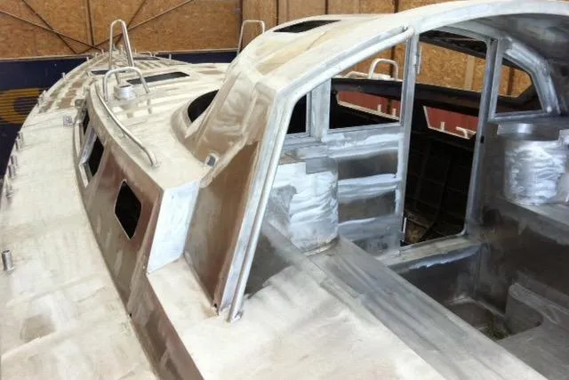 Slide: The Image of Aluminum hull of a 2017 Boreal 47 sailboat under construction in a workshop. - 33