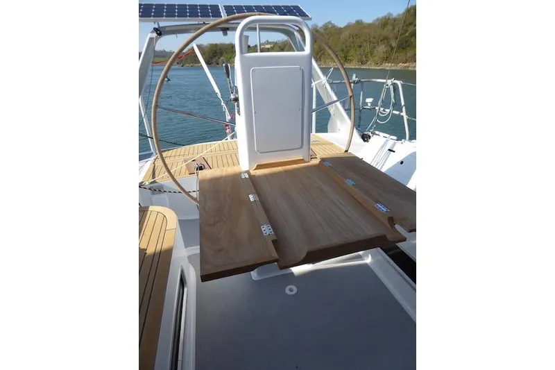 Slide: The Image of Sailboat cockpit of 2017 Boreal 47 with wooden table and solar panel. - 8