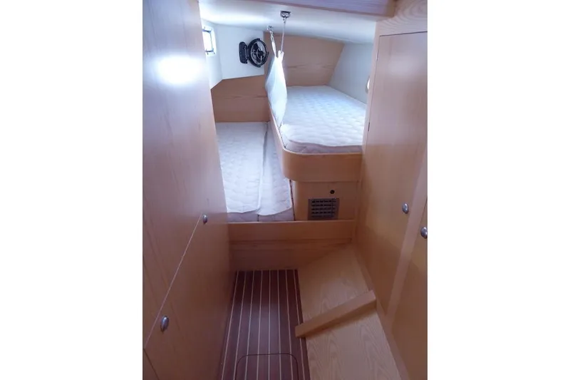 Slide: The Image of Interior cabin of 2017 Boreal 47 yacht with wooden finish and cozy bedding. - 9
