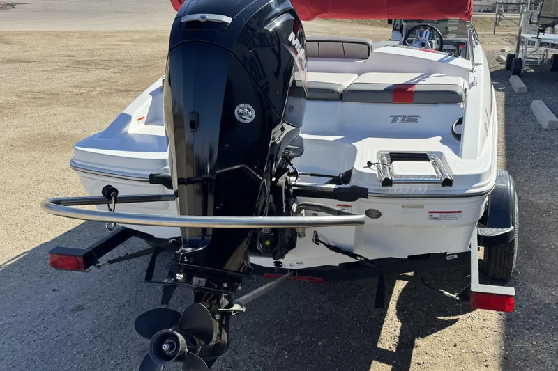 Slide: The Image of 2021 Tahoe T16 boat with outboard motor on trailer, rear view. - 4