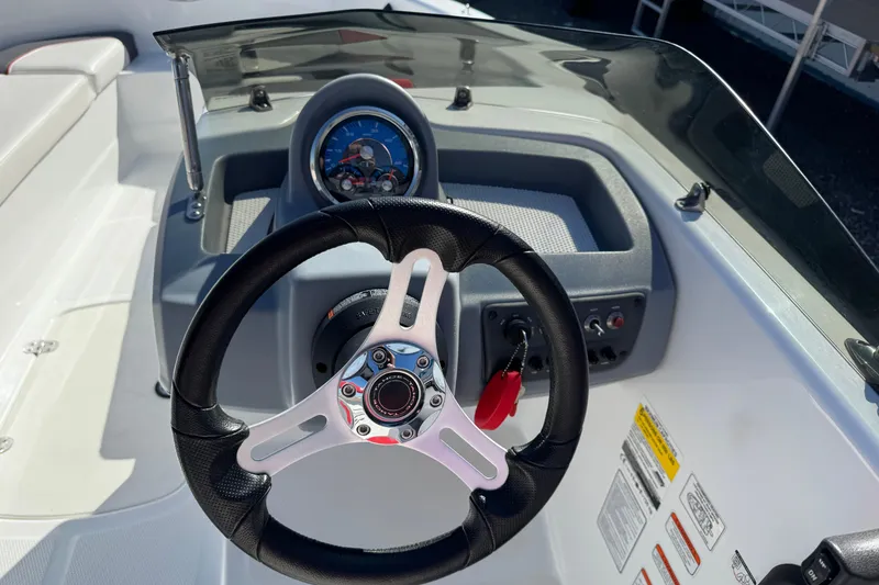 Slide: The Image of Steering wheel and dashboard of a 2021 Tahoe T16 boat. - 7