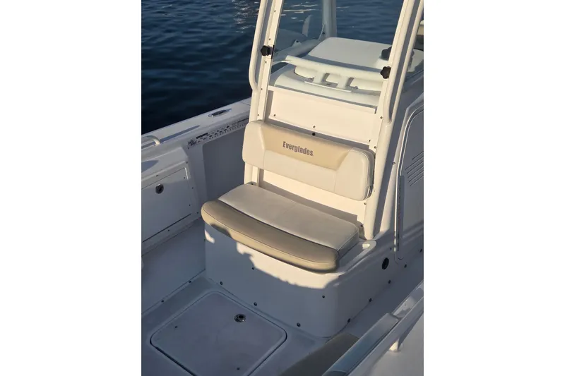 Slide: The Image of 2017 Everglades 243 Center Console boat interior with cushioned seating. - 11
