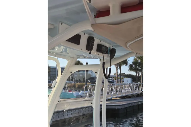 Slide: The Image of 2017 Everglades 243 Center Console boat interior with electronics, dockside view. - 12