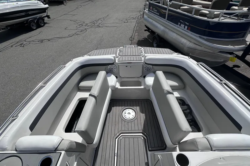 Slide: The Image of 2023 Starcraft SVX 191 OB boat interior with gray seating and deck. - 15