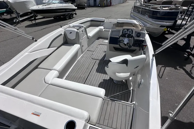 Slide: The Image of 2023 Starcraft SVX 191 OB boat interior with seating and steering console. - 6