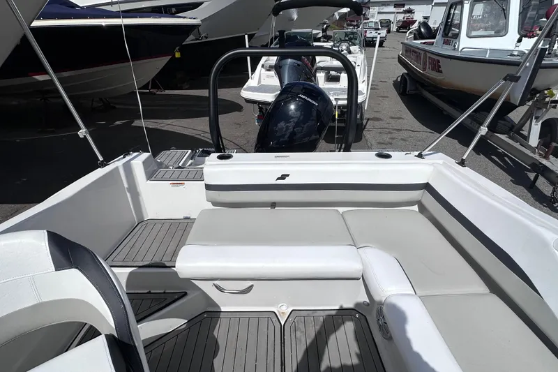 Slide: The Image of 2023 Starcraft SVX 191 OB boat interior with seating and motor view. - 7
