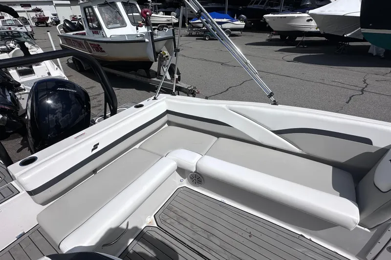 Slide: The Image of 2023 Starcraft SVX 191 OB boat interior with cushioned seating and sleek design. - 8