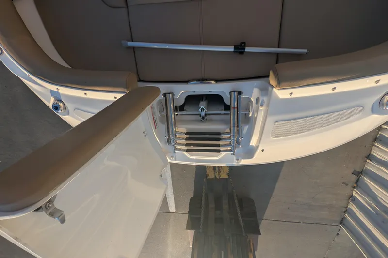 Slide: The Image of 2022 Sea Ray SDX 250 Outboard swim platform with ladder and seating area. - 27
