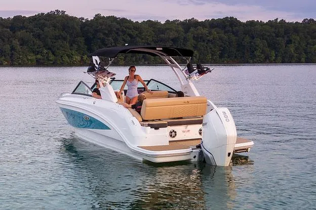 Slide: The Image of Manufacturer Provided Image: 2022 Sea Ray SDX 250 Outboard boat on a serene lake with passengers. - 33