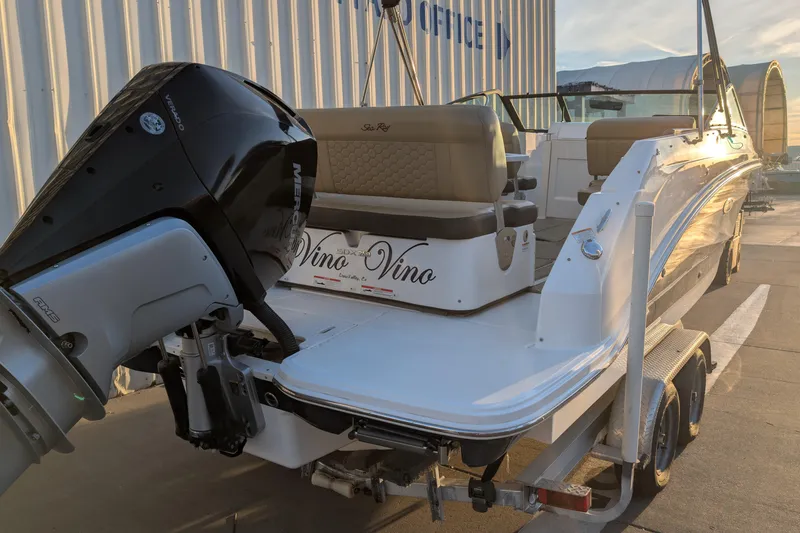 Slide: The Image of 2022 Sea Ray SDX 250 Outboard boat on trailer, featuring a powerful engine. - 7