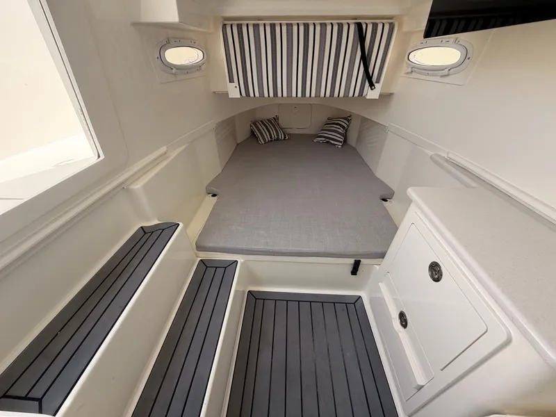 Slide: The Image of Interior of 2025 Cobia 350 Center Console with sleeping area. - 12