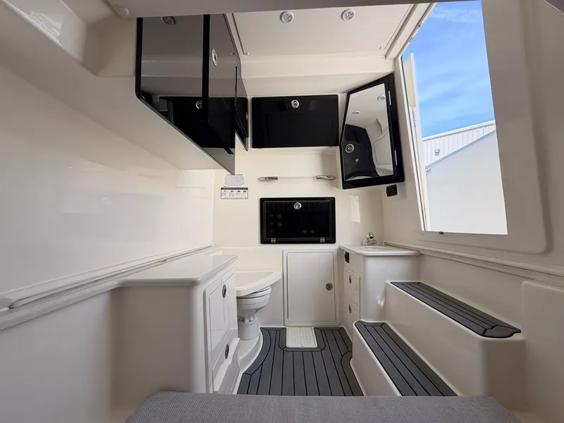 Slide: The Image of Interior of 2025 Cobia 350 Center Console with modern amenities. - 13