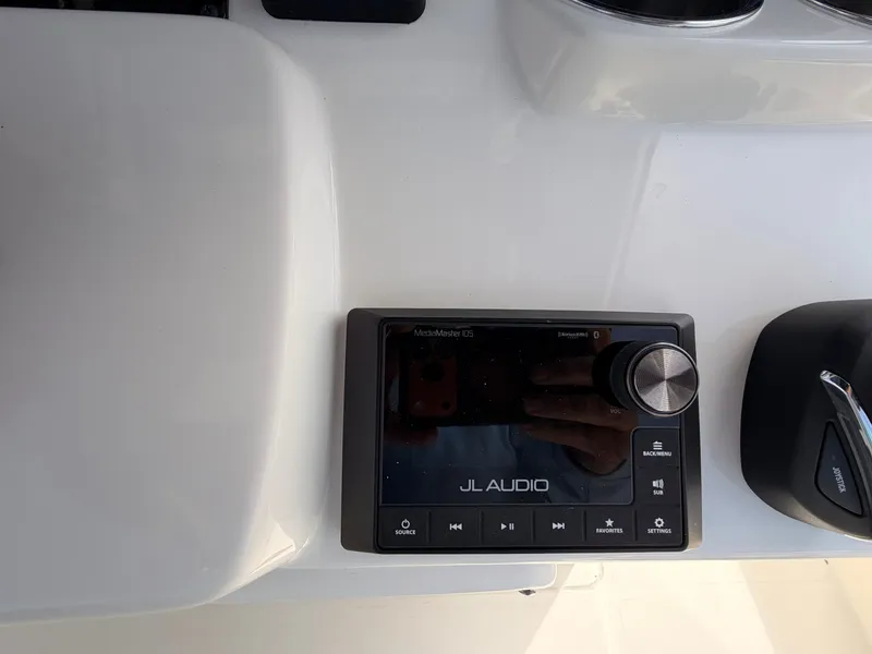 Slide: The Image of JL Audio control on 2025 Cobia 350 Center Console. - 18