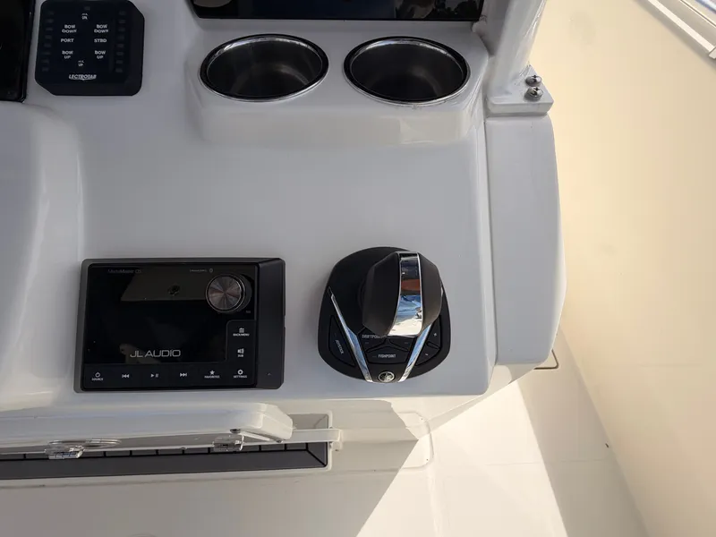 Slide: The Image of Cobia 350 Center Console 2025 helm with JL Audio system. - 19