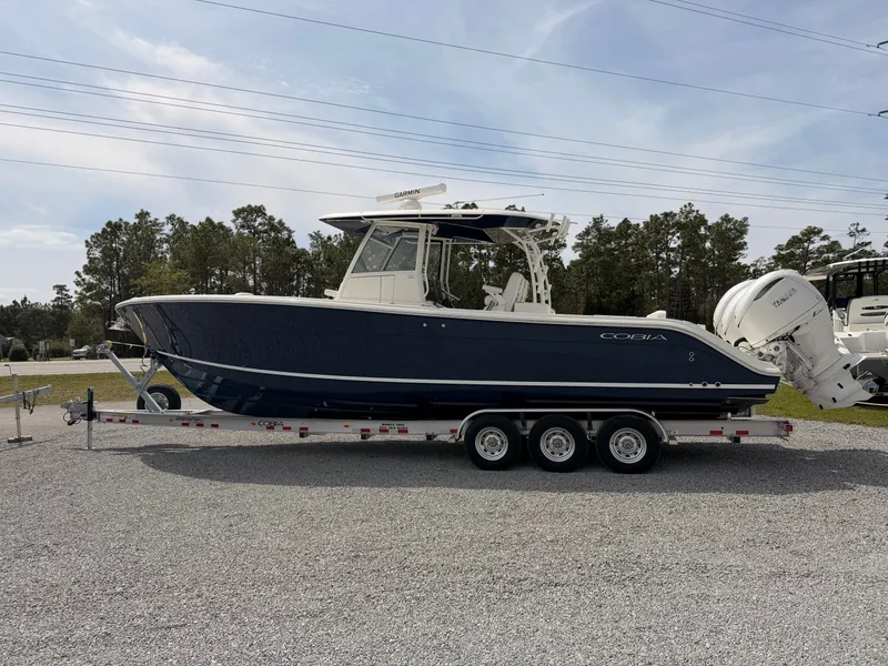Slide: The Image of 2025 Cobia 350 Center Console boat on trailer. - 2