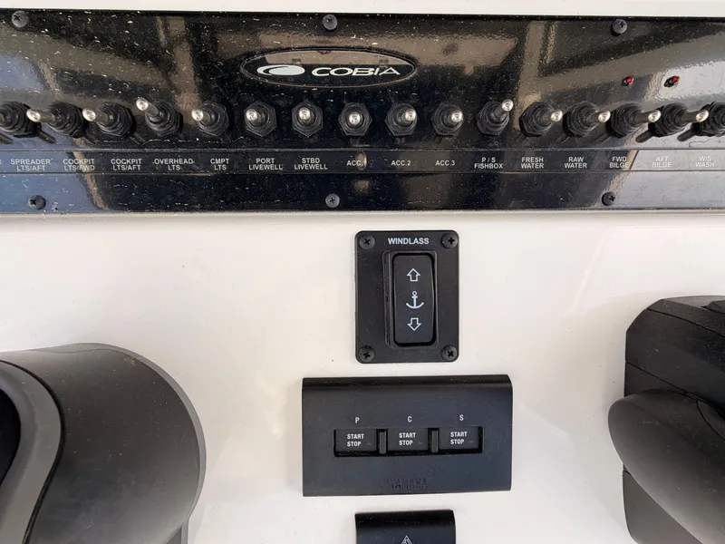 Slide: The Image of Cobia 350 Center Console 2025 control panel with switches and windlass control. - 21