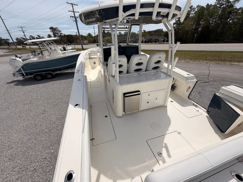Slide: The Image of 2025 Cobia 350 Center Console boat on display lot. - 5