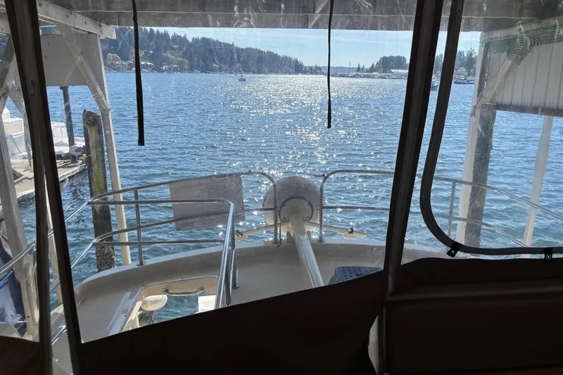 Slide: The Image of View from 2007 Mainship 34 Trawler, overlooking serene waters and distant shoreline. - 15