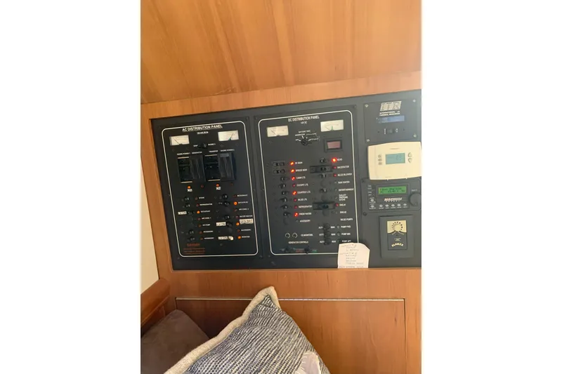 Slide: The Image of Electrical control panel on a 2007 Mainship 34 Trawler boat interior. - 28