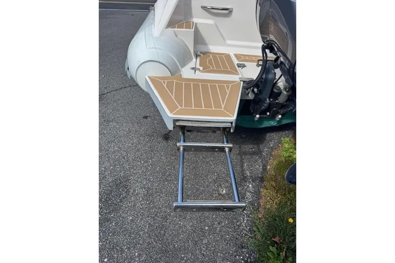 Slide: The Image of 2018 Zar Formenti 49 SL boat with extended swim ladder on pavement. - 10