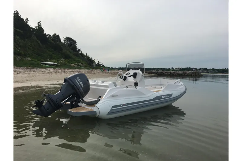 Slide: The Image of 2018 Zar Formenti 49 SL boat with Yamaha motor on a calm shoreline. - 14